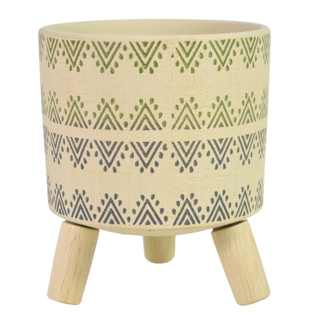 Maceta de cerámica con patas de madera beige